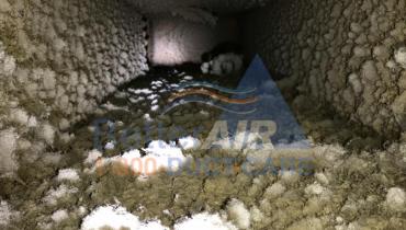 Severely Dirty Fiber Glass Air Duct - BEFORE Cleaning